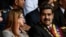 Nicolas Maduro y la primera dama de Venezuela Cilia Flores asisten a una ceremonia militar en Caracas. 