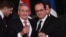 Brindis en el Palacion del Elíseo entre Raúl Castro y Francois Hollande.